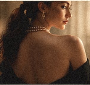 Mood image: a bare shoulder in soft light, pearls at the neck