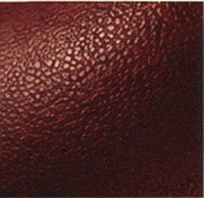 Mood image: close grain of deep oxblood leather